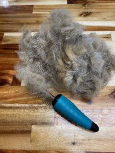 Large volume of feline undercoat removed during deshedding session